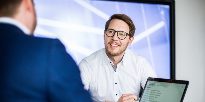 Smiling employee in conversation